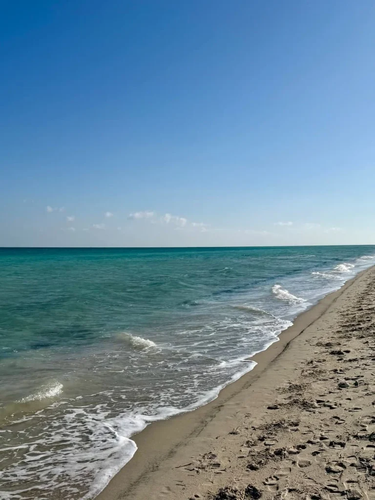 The main portion of the beach in Djerba. The sea is a green and blue colour with white powdery sand, Tunisia