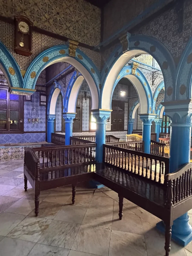 El Ghriba Synagogue, Djerba, Tunisia. The blue interiors have mosaic arches and Hebrew verses written on the walls