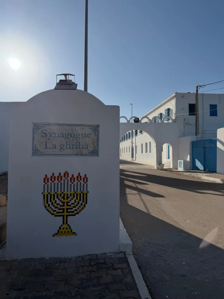 Th exterior of the El Ghriba Synagogue which is white