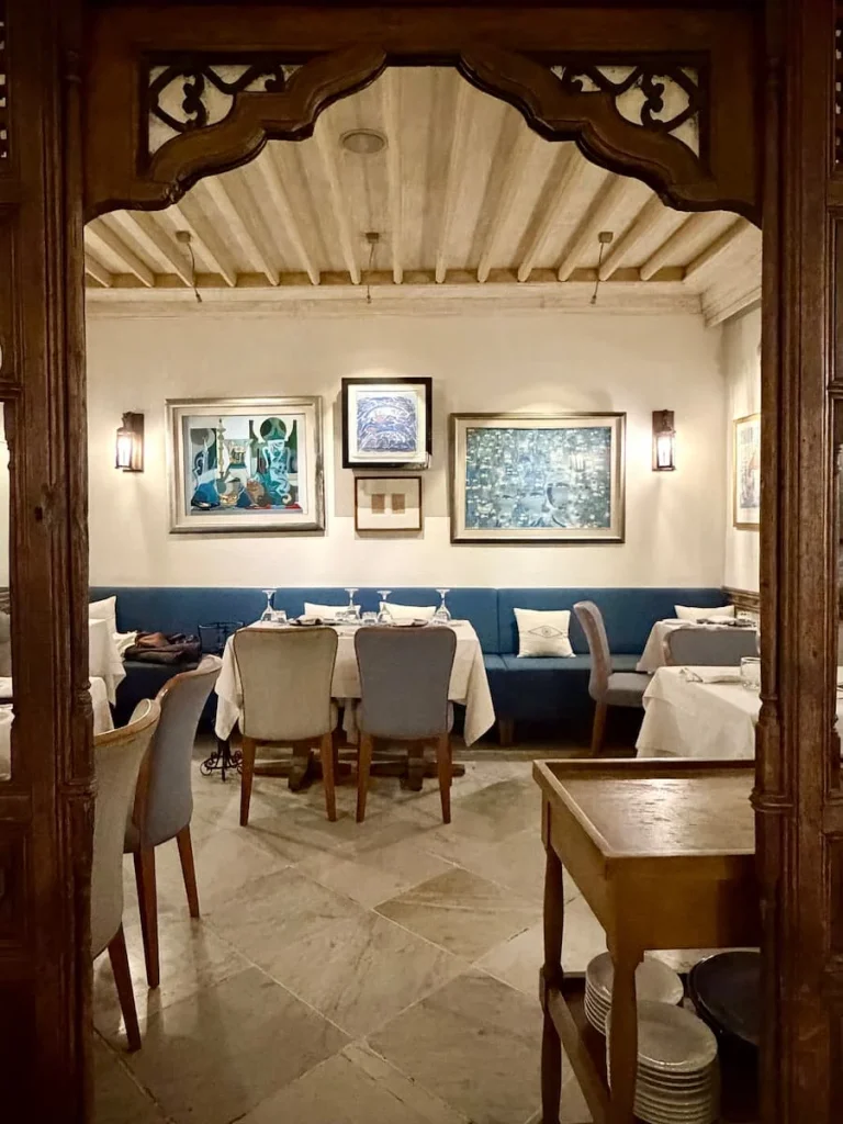 Interior arch at Au Bon Vieux Temps, Sidi Bou Said with tables set up for dinner service