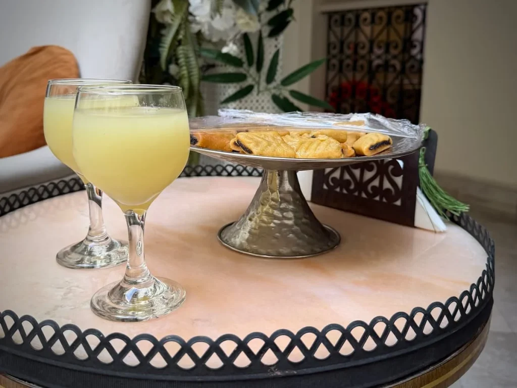 Things to do in Kairouan, try the Makroudh on a silver plate with biscuit on the outside adn dates in the middle with lemon juice, Dar Alouini, Tunisia