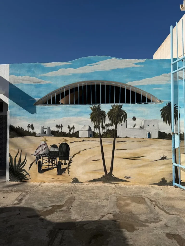 Street art in Houmt Souk, Djerba with palm trees and beach scenes