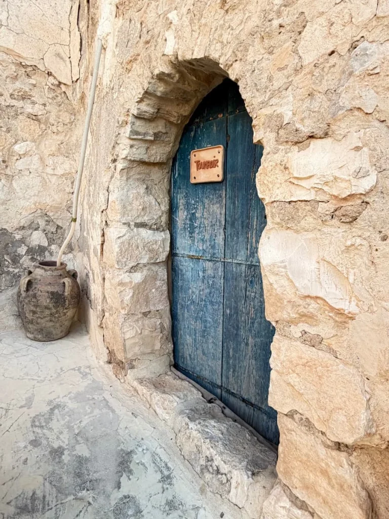 Blue Suite Toumadir front door with stone-work around it at L'Auberge de Tamezret