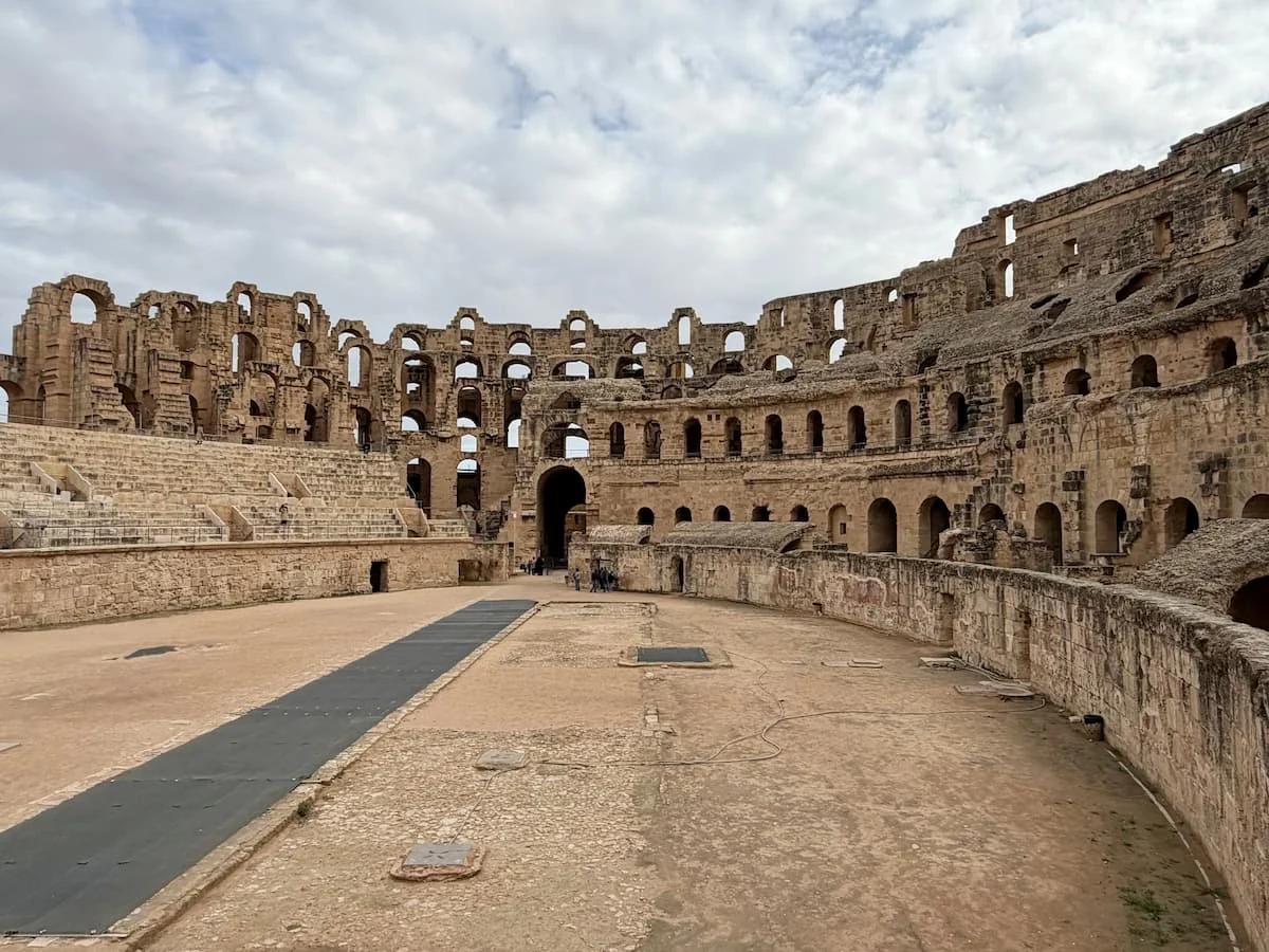 El Djem Amphitheatre Interior. Tunisia. The structure is a colosseum with a walkway in the middle and thousands of seats surrounding in a circlular design