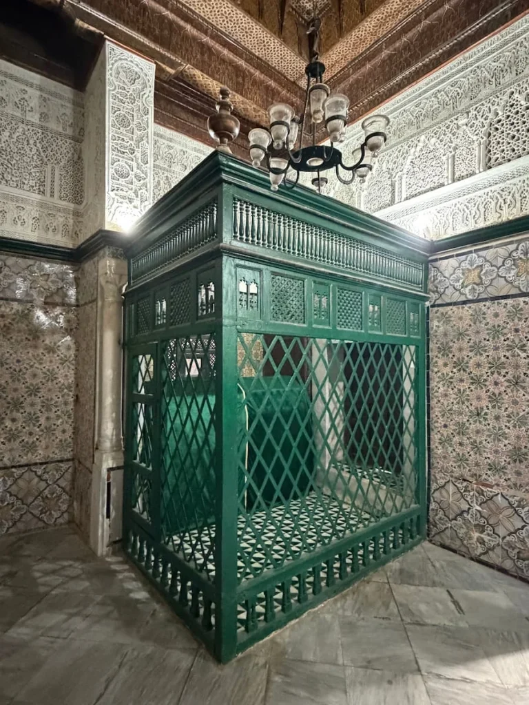 The green outer metal intricately decorated Mausoleum of Sidi Sahbi in Kairouan, Tunisia